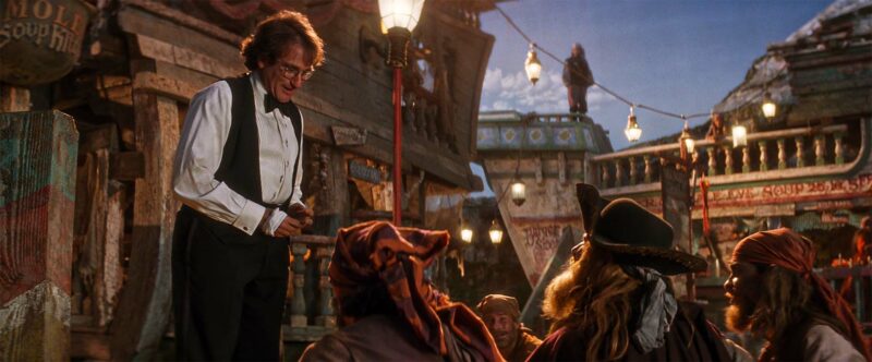 Peter during his second confrontation with the pirates, his hand bandaged after Tink has cut it.