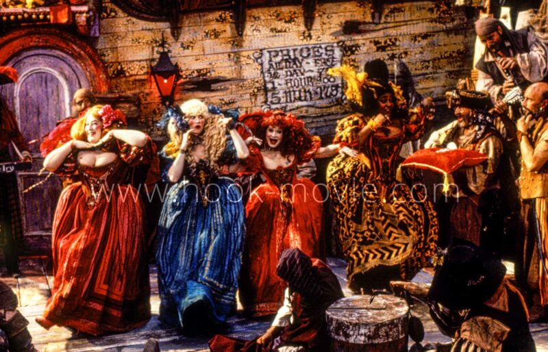 Pirate wenches welcome Smee, dancing and singing.