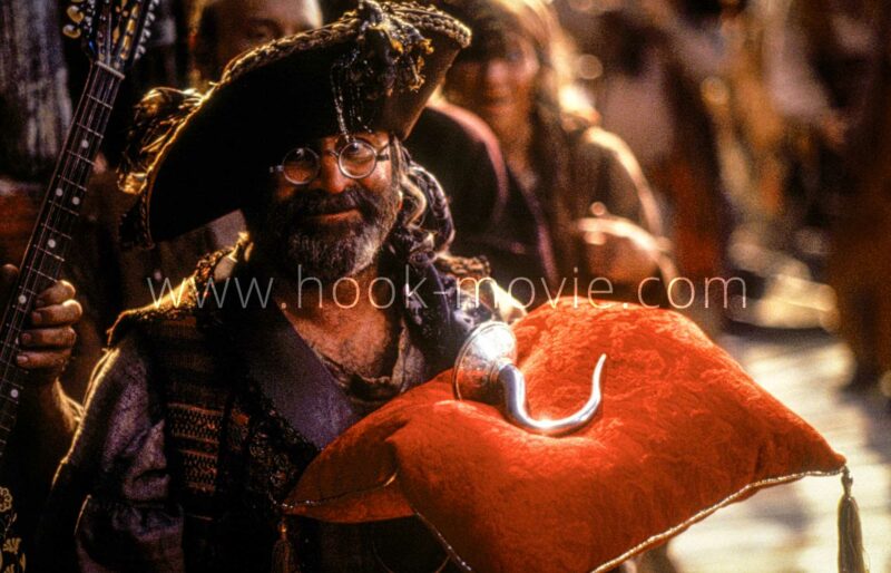 Smee holding the Hook.