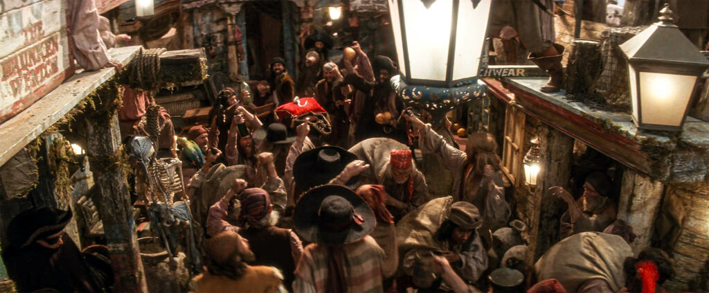 Smee leaving the tavern and leading the pirates toward the tunnel leading to the Jolly Roger