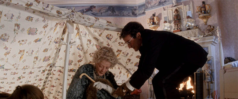 Peter has the safety pin on his sleeve when he comes to get Wendy.