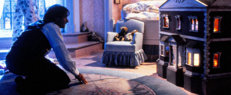 The nursery rug depicts a map, and a compass can be seen on it.