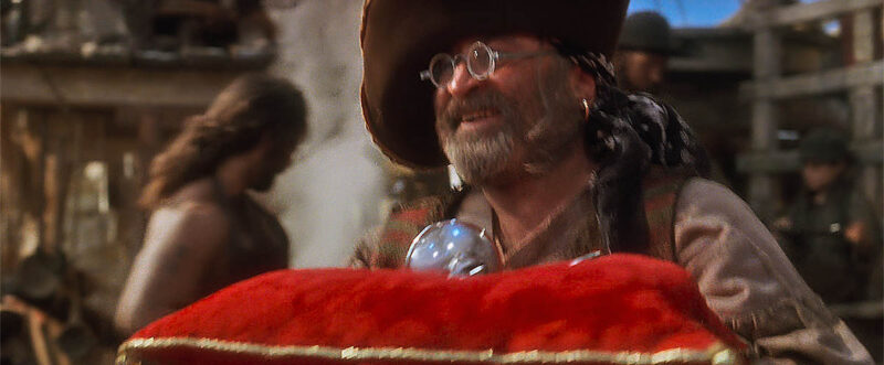 Two others visible behind the blacksmith pirates and Smee.