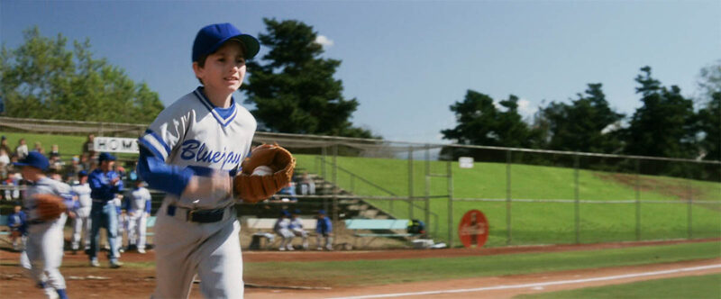 Coca-Cola signs visible in the background.