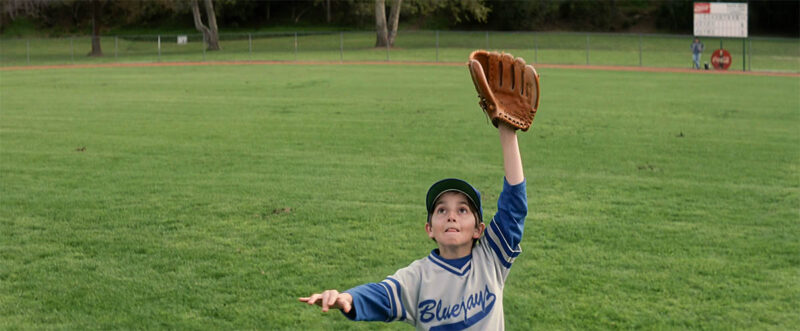 Coca-Cola signs visible in the background.