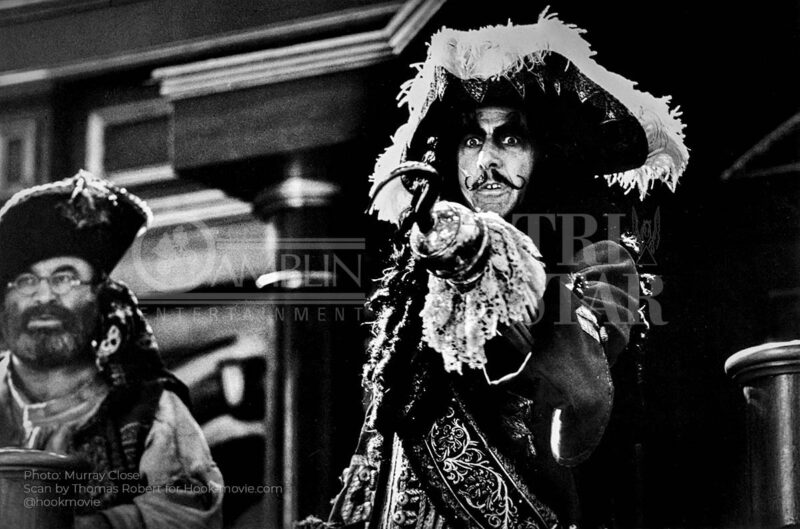 Tickles playing the concertina as the crowd cheers for Captain Hook.